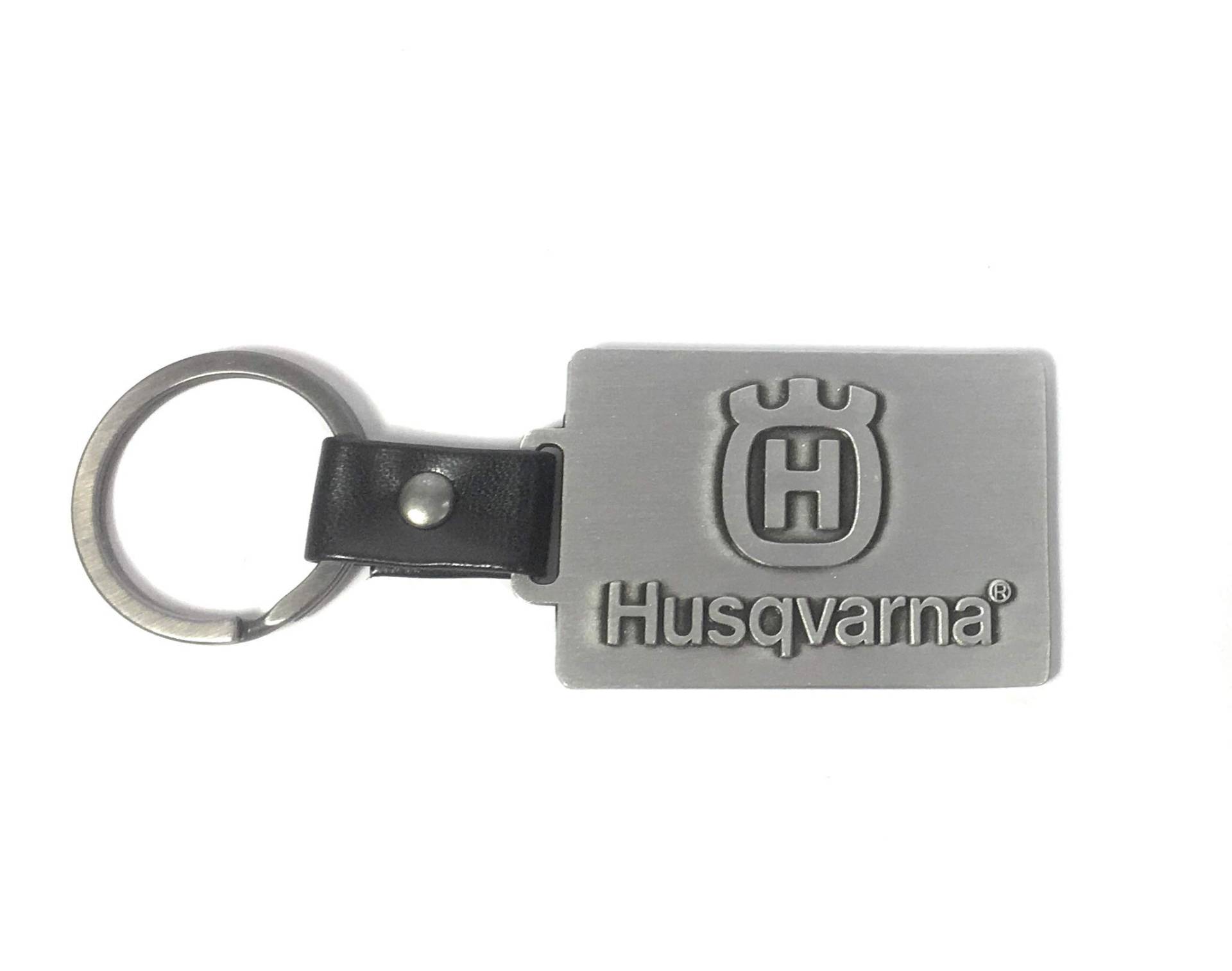 Husqvarna Schlüsselanhänger Metall mit Logo und Ring Verbindung aus Leder von Husqvarna